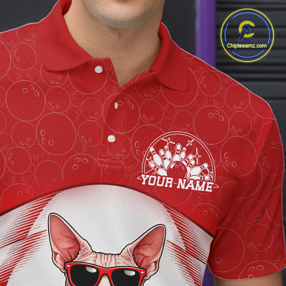 Close-up of the left chest area on a white and red bowling polo shirt featuring a sphynx cat in sunglasses beside a bowling ball.
