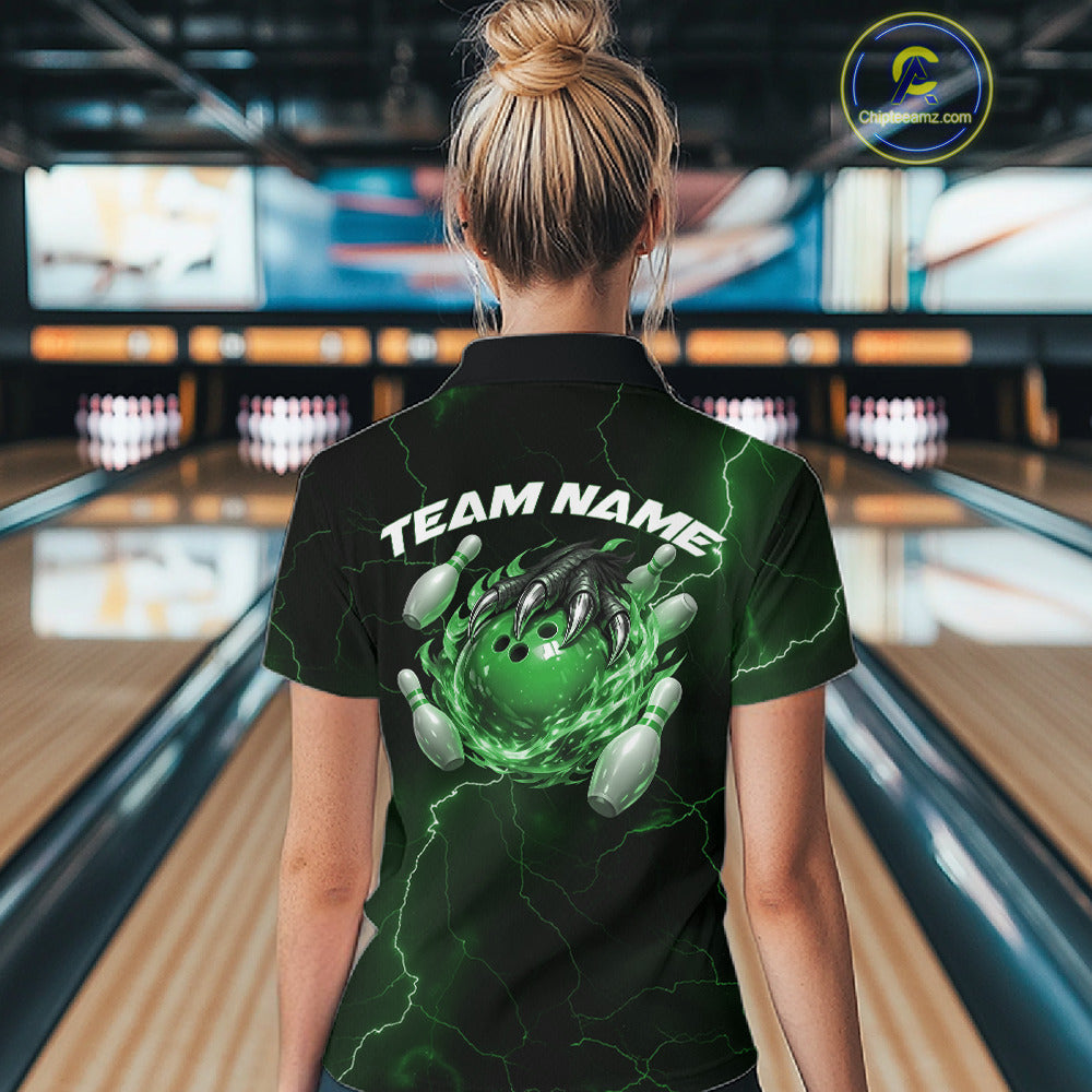 Back view of a black and green womens bowling polo showcasing a flaming bowling ball and dragon claw motif.