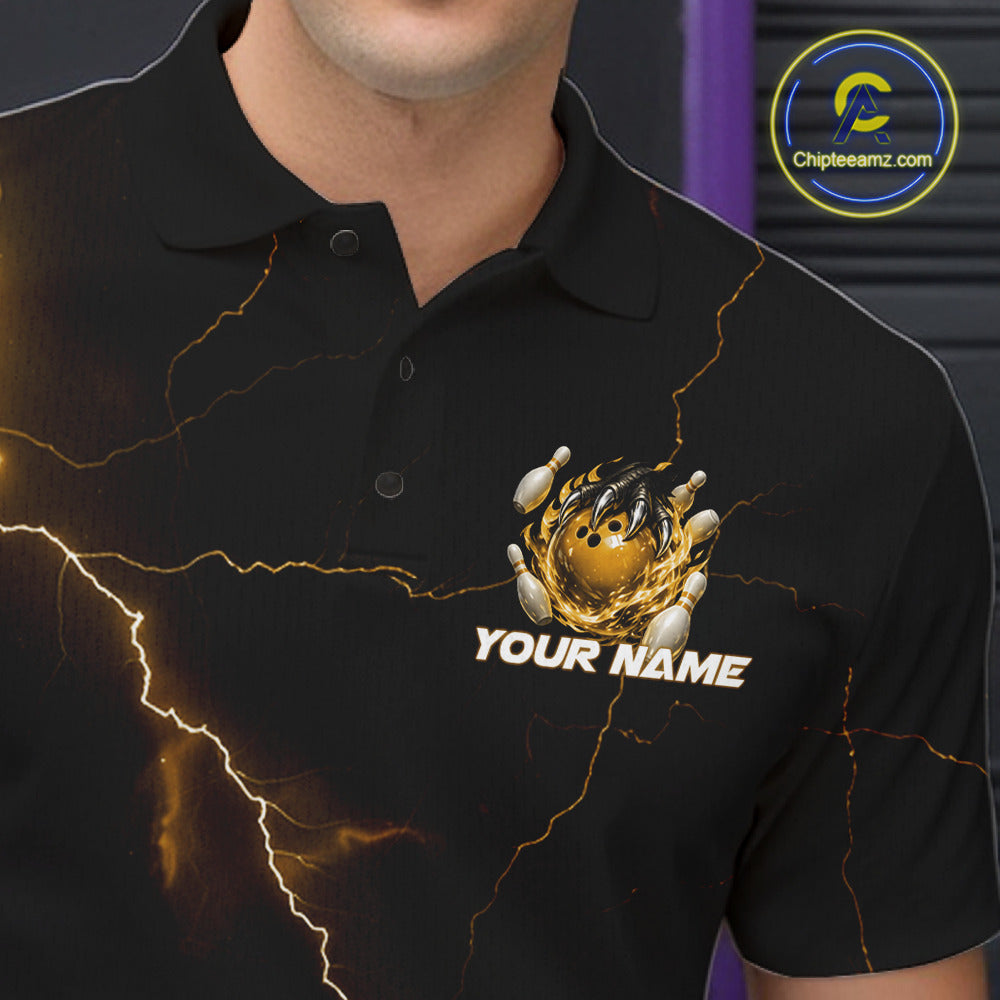 Close-up left chest detail of a black and yellow bowling polo featuring a dragon claw and flaming bowling ball graphic.