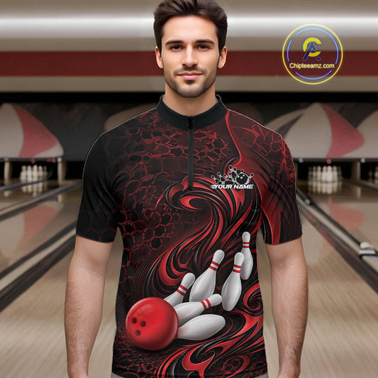 Male model wearing a black and red bowling quarter-zip shirt in a bowling alley featuring a tribal flame bowling ball and pins graphic