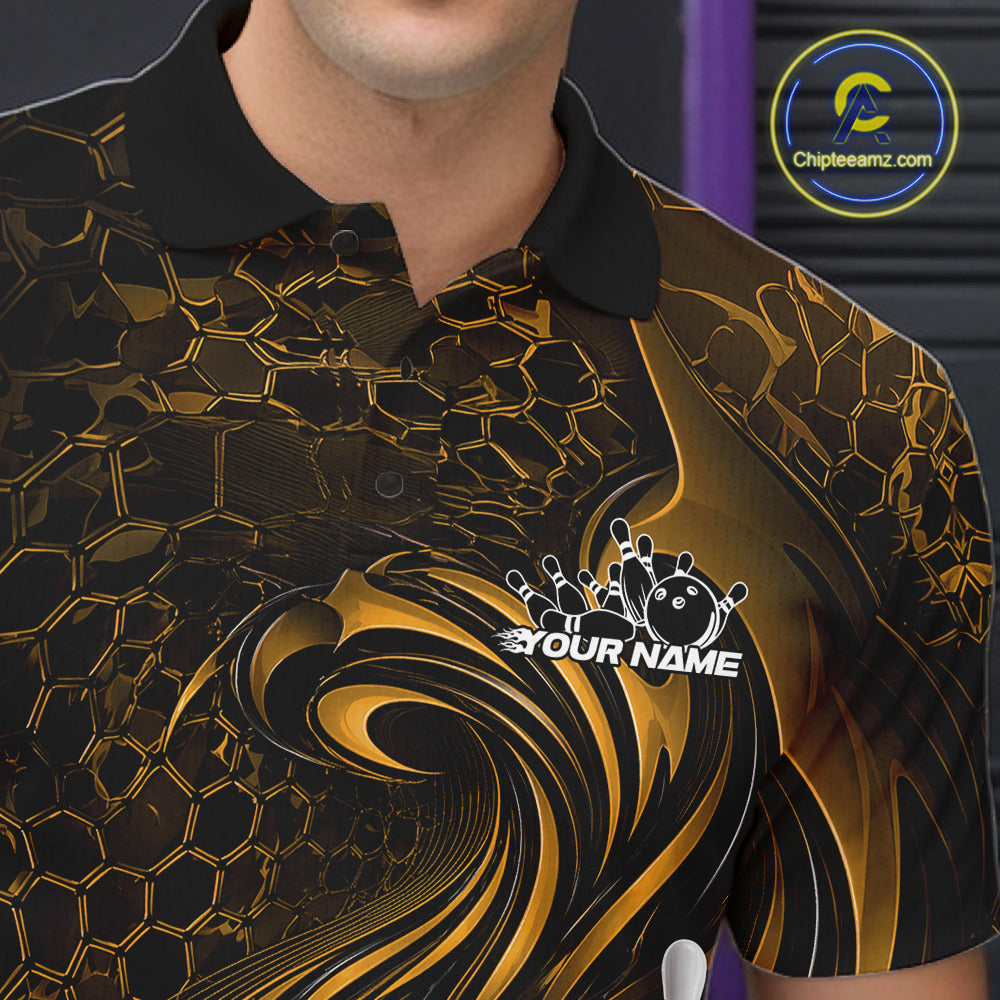 Close-up of the left chest on a black and yellow bowling polo shirt featuring a tribal flame bowling ball and pins graphic