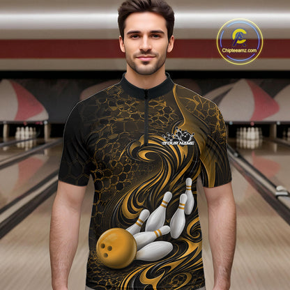 Male model wearing a black and yellow bowling quarter-zip shirt in a bowling alley featuring a tribal flame bowling ball and pins graphic