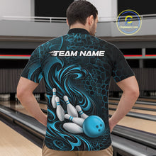 Load image into Gallery viewer, Male model wearing a black and blue bowling quarter-zip shirt in a bowling alley featuring a tribal flame bowling ball and pins graphic