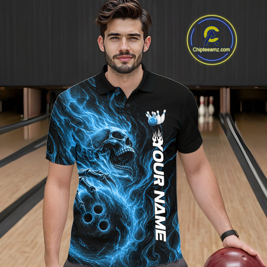 Male model wearing a black bowling polo shirt in a bowling alley featuring a skull clutching a bowling ball surrounded by swirling blue energy flames