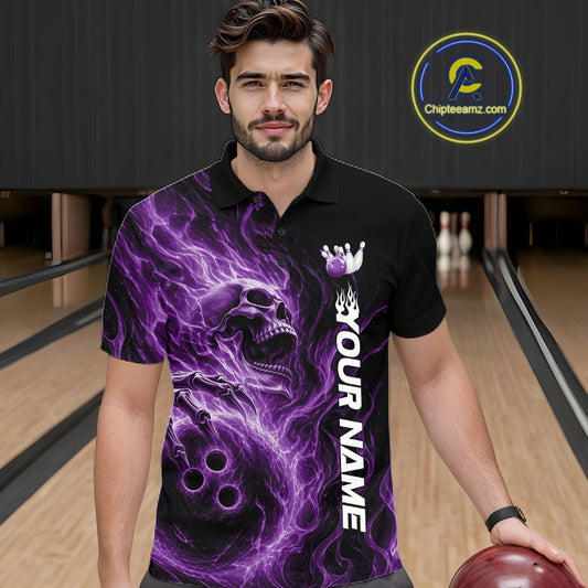 Male model wearing a black bowling polo shirt in a bowling alley featuring a skull clutching a bowling ball surrounded by swirling purple energy flames