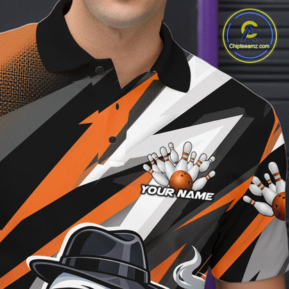 Detailed left chest view of a black and orange bowling polo showcasing duck and bowling-inspired artwork.