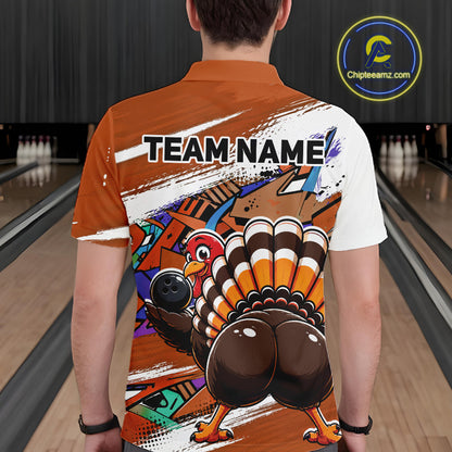 Back view of a male model wearing an orange custom bowling polo shirt featuring a funny graffiti style turkey holding a bowling ball, paint splatter details, and a custom name in a bowling alley.