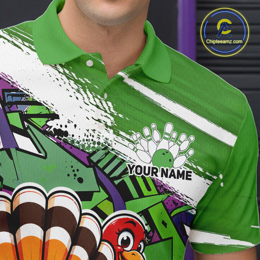 Close up front view of the left chest area on a green custom bowling polo shirt, featuring a graffiti inspired urban street style design with paint splatter accents and a personalized name.