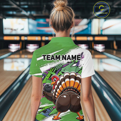 Back view of a female model in a bowling alley wearing a green custom quarter zip bowling shirt with a funny graffiti turkey holding a bowling ball, paint splatter accents, and a personalized name.