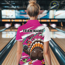 Load image into Gallery viewer, Back view of a female model in a bowling alley wearing a pink custom quarter zip bowling shirt with a funny graffiti turkey holding a bowling ball, paint splatter accents, and a personalized name.