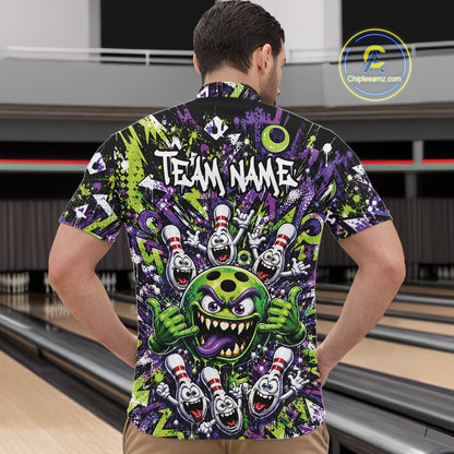 Male model wearing a green and purple bowling quarter-zip shirt in a bowling lane showcasing a mischievous green monster bowling ball with sharp teeth, a purple tongue, playful hand gesture, and cheerful cartoon bowling pins.