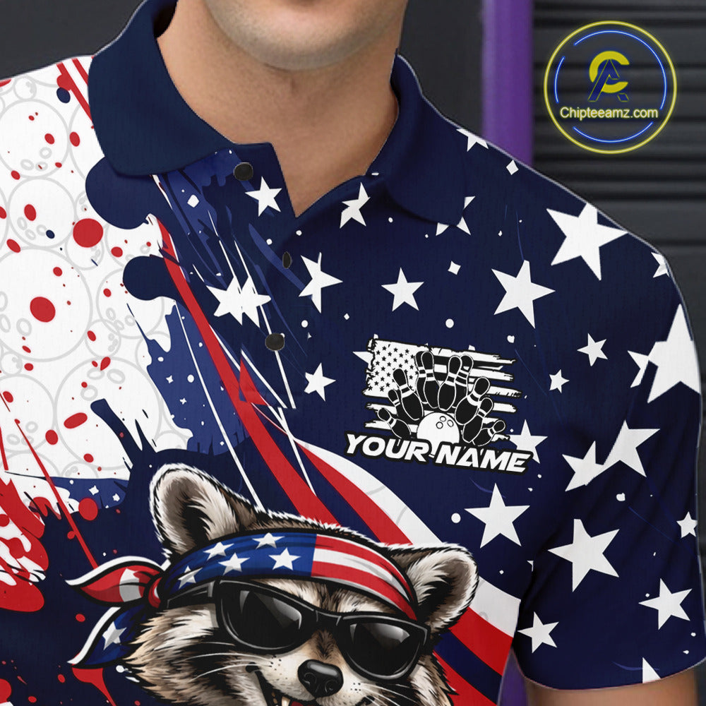 Left chest close-up of a bowling polo displaying a patriotic raccoon and bowling ball graphic.