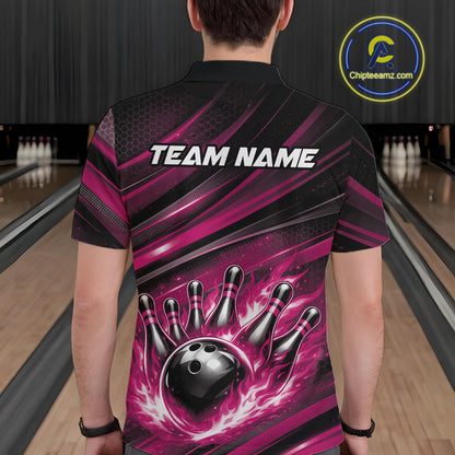 Back view of a male model in a bowling venue wearing a black and pink polo shirt featuring a flaming bowling ball hitting the pins.