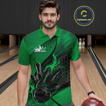 Male model wearing a black and green bowling polo shirt at a bowling lane with fiery bowling strike artwork and hexagonal graphics.