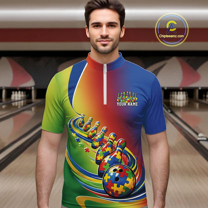 Male model in a bowling lane wearing a colorful quarter-zip shirt, autism puzzle bowling ball and pins illustration with vibrant symbolic artwork.