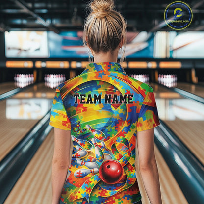 Back view of a female bowler wearing a colorful quarter-zip shirt, puzzle-themed autism bowling illustration with multi-color accents.
