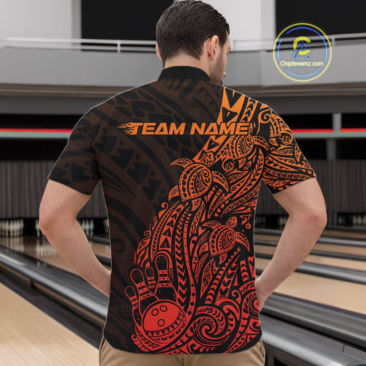 Front view of a male model in a black and red orange bowling quarter-zip shirt displaying tribal bowling artwork.