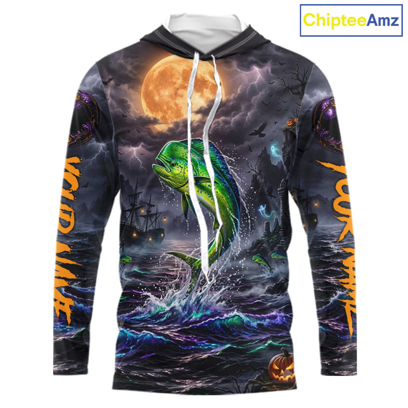 A long-sleeve hoodie with an all-over Halloween-themed graphic print featuring a green mahi-mahi fish jumping from dark ocean waves under a large orange full moon, with spooky ships and lightning in the background. The hoodie has white drawstrings and a white inner hood lining, shown on a plain white background with a ChipteeAmz logo in the top right corner.