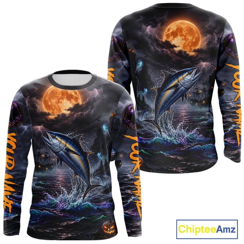 A long-sleeve crewneck shirt shown from both front and back, featuring a dramatic all-over Halloween-style print of a tuna fish jumping from dark ocean water under a large orange full moon, with orange text running down the sleeves and a ChipteeAmz logo in the bottom right corner.