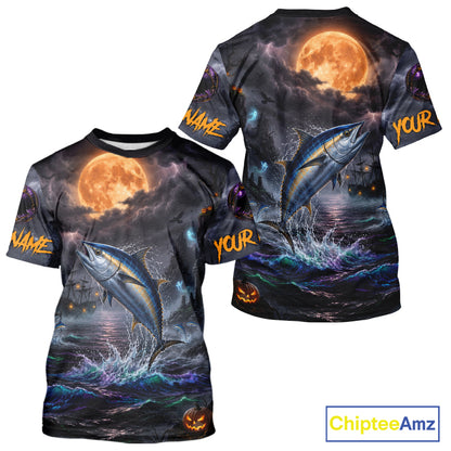 Front and back views of a short-sleeve t-shirt with an all-over Halloween print featuring a jumping fish, a full moon, stormy clouds, and orange text reading 'NAME' and 'YOUR' on the sleeves, shown on a white background with a ChipteeAmz logo in the corner.