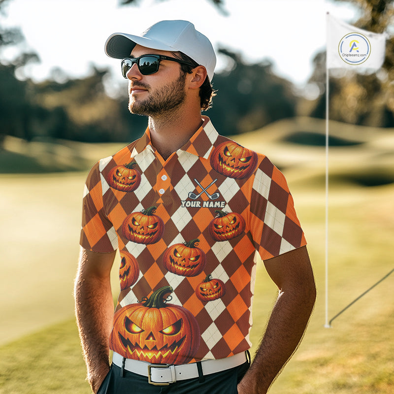 A man wearing a custom short-sleeve polo shirt with a Halloween-themed argyle pattern of orange pumpkins and cream diamonds, standing on a golf course.