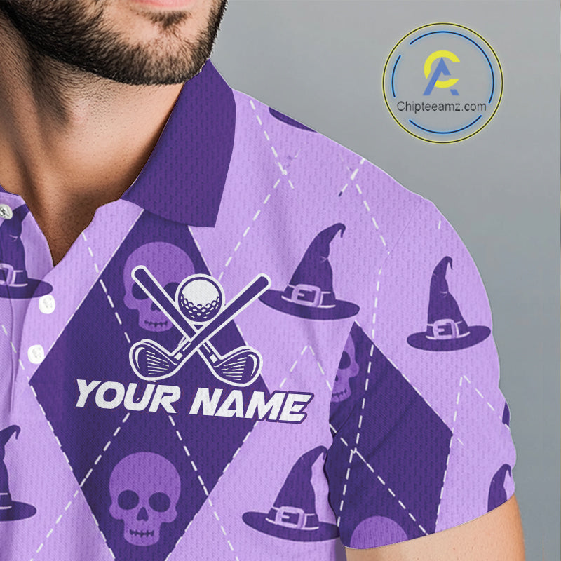 A close-up of a man wearing a purple and lavender argyle golf shirt with witch hats, skulls, crossed golf clubs, and a customizable 'YOUR NAME' print on the chest.