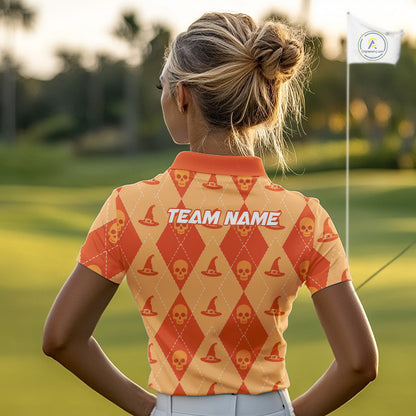 A woman on a golf course seen from behind, wearing a short-sleeve collared golf shirt with an orange and beige diamond pattern featuring skull and witch hat motifs, and 'TEAM NAME' printed across the upper back.