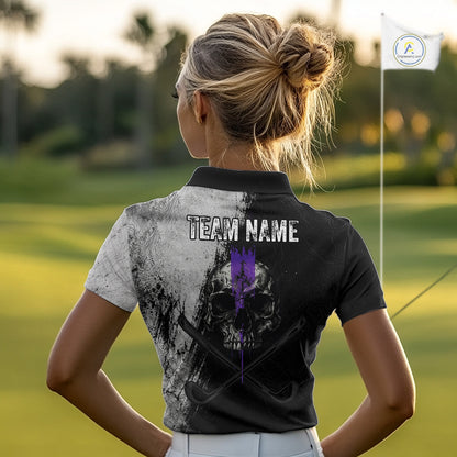 Person wearing a black polo shirt with a skull design and 'Team Name' text on a golf course.