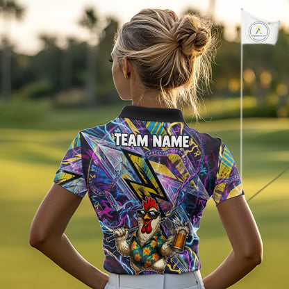 A woman viewed from behind on a golf course, wearing a short-sleeve collared polo shirt with a colorful abstract graphic print and a cartoon rooster on the back. The shirt has 'TEAM NAME' printed across the upper back, and a small white flag with a logo is visible in the background.