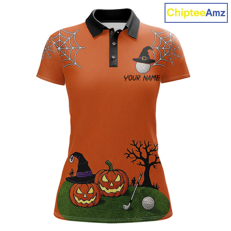 An orange short-sleeve polo shirt with a black collar, featuring a Halloween-themed print with spiderwebs, pumpkins, a witch hat, a bare tree, and golf balls. The shirt includes a customizable text placeholder 'YOUR NAME'.