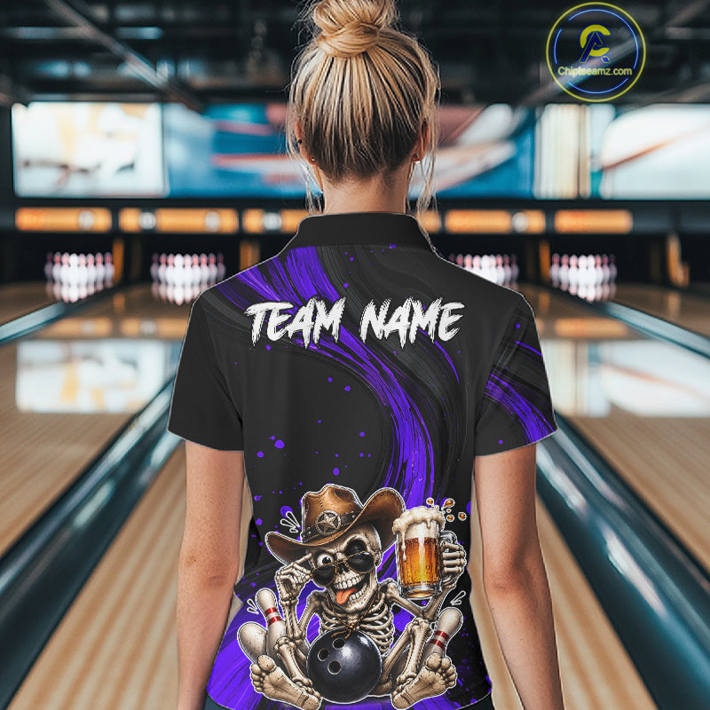 Person wearing a black and purple bowling shirt with a skeleton design in a bowling alley.