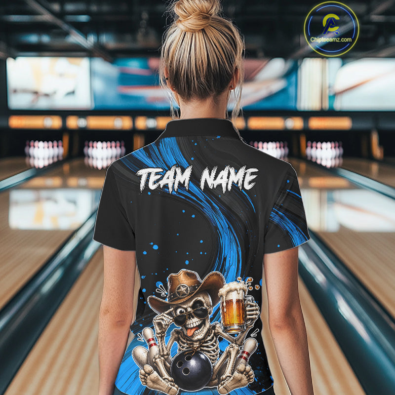 Person wearing a black and blue bowling shirt with a skeleton design in a bowling alley.