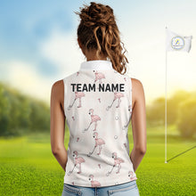 Load image into Gallery viewer, Woman wearing a sleeveless polo shirt with flamingo patterns and 'TEAM NAME' text on a golf course.