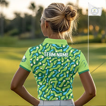 Load image into Gallery viewer, Green sports jersey with a pattern and branding on a person wearing it.