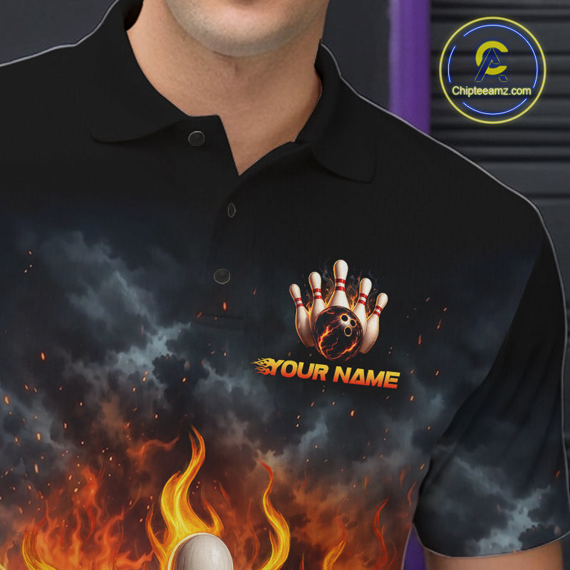 A close-up of a person wearing a black short-sleeve polo shirt with a dramatic bowling-themed graphic print featuring flames, smoke, bowling pins, and a bowling ball, with the text 'YOUR NAME' on the chest. A circular 'Chipleeamz.