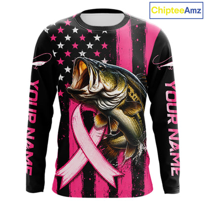 A long-sleeve graphic shirt with a black and pink distressed background, featuring a large bass fish jumping over a pink ribbon, with 'YOUR NAME' printed down both sleeves. A 'ChipteeAmz' logo is visible in the top right corner.