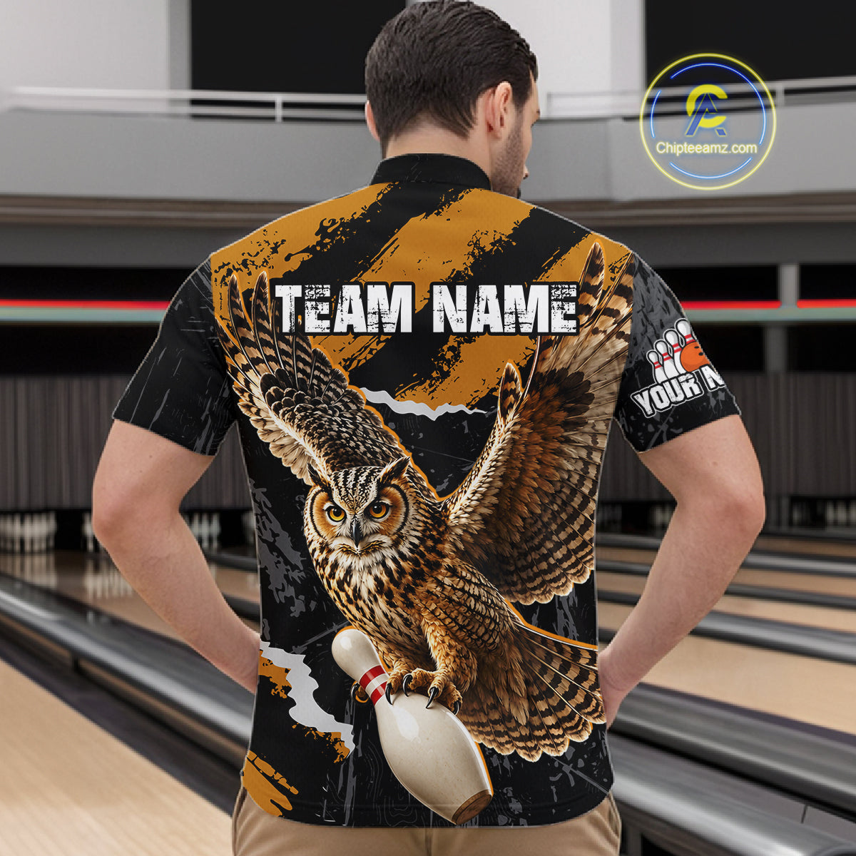 A man viewed from behind wearing a custom bowling shirt with a large graphic of an owl catching a bowling pin, with 'TEAM NAME' and 'YOUR NAME' printed on the back. The shirt has a black and orange background with a bowling alley scene.