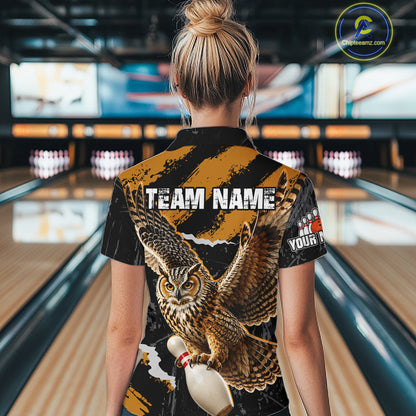 A woman viewed from behind wearing a short-sleeve bowling shirt with a large owl graphic and customizable text on the back, standing in a bowling alley.