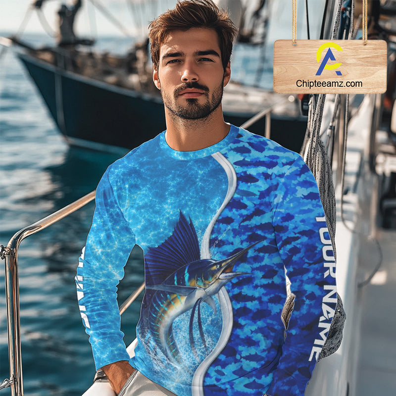 Angler wearing Sailfish fishing blue ocean camouflage performance long sleeve fishing shirt on the water