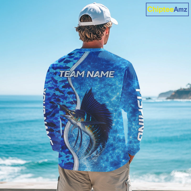 Angler wearing Sailfish fishing blue ocean camouflage performance long sleeve fishing shirt on the water with personalized name
