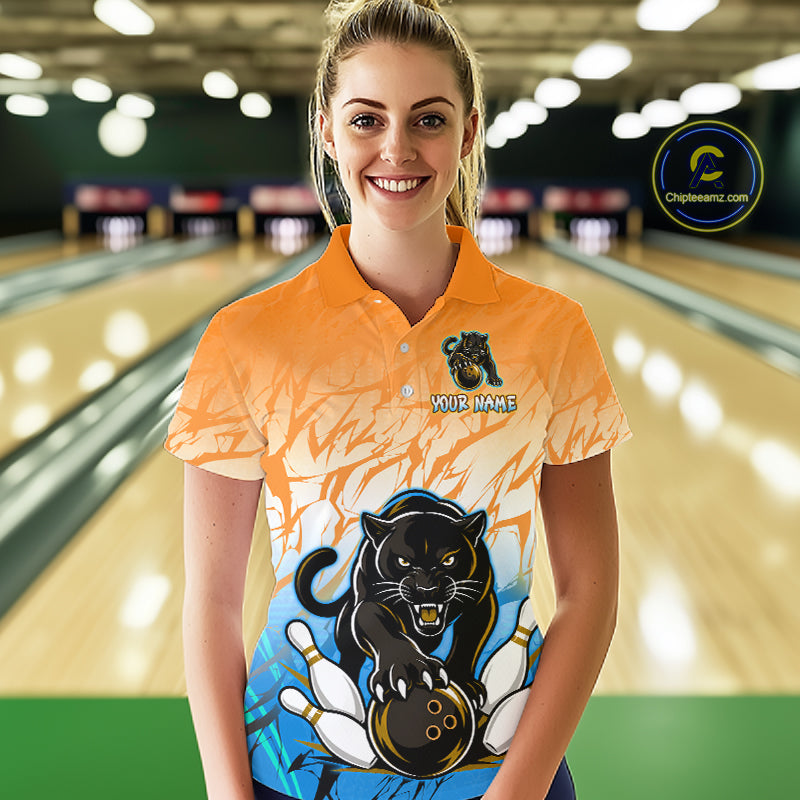 Bowler wearing custom orange and blue leopard bowling shirt on the lanes