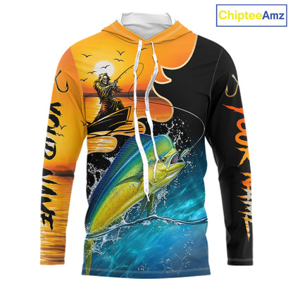 Long sleeve hooded fishing shirt with a fish reaper and mahi mahi design on a sunset background