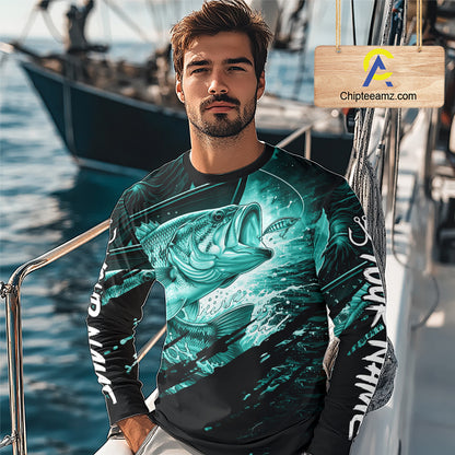 Man wearing a long sleeve fishing shirt with a teal bass fish design on a boat