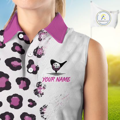 Woman wearing a sleeveless golf shirt with a leopard print and golf ball design, on a blurred golf course background.
