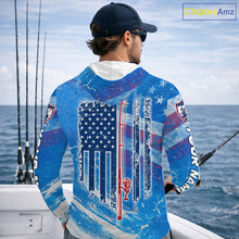 Load image into Gallery viewer, Man on a boat wearing a blue American flag northern pike hooded fishing shirt