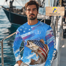Load image into Gallery viewer, Man wearing a blue patriotic redfish fishing shirt with custom name, standing on a boat