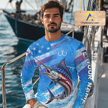 Load image into Gallery viewer, Man wearing a blue patriotic marlin fishing shirt long sleeve with custom name, standing on a boat