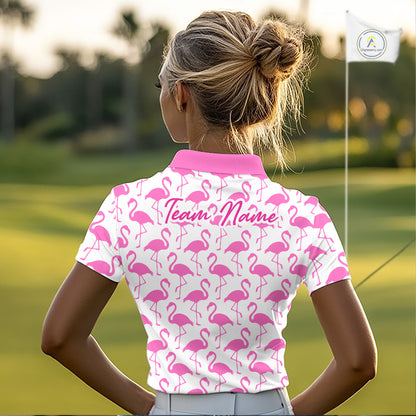 Woman wearing a white polo shirt with pink flamingo pattern and 'Team Name' text on the back, standing on a golf course.