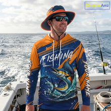 Load image into Gallery viewer, Angler wearing Custom Marlin Fishing Blue Orange long sleeve hooded saltwater fishing jersey 