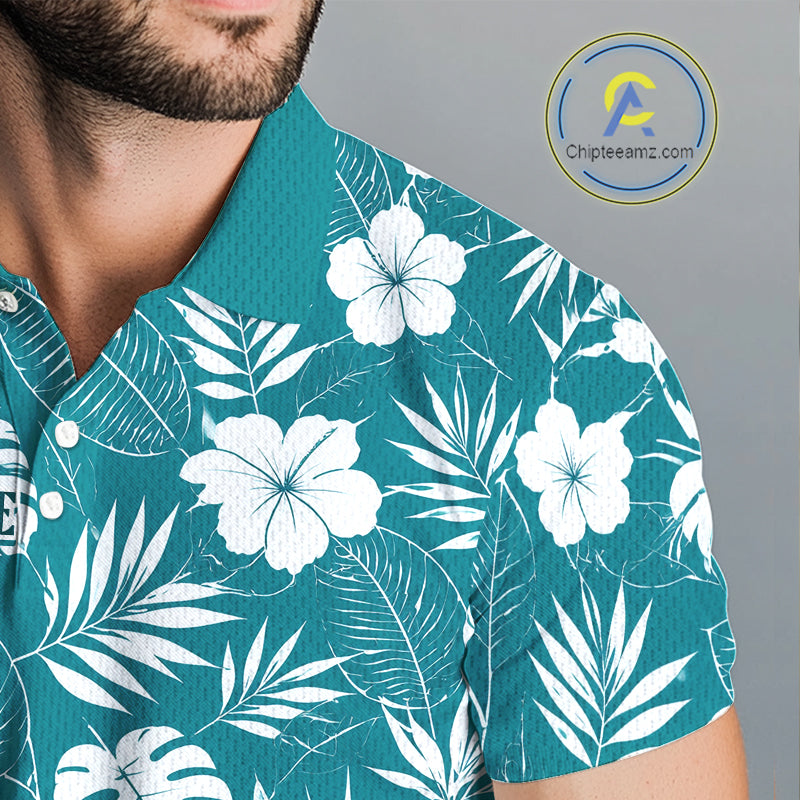 Teal shirt with white floral and leaf pattern worn by a person with breathable fabric